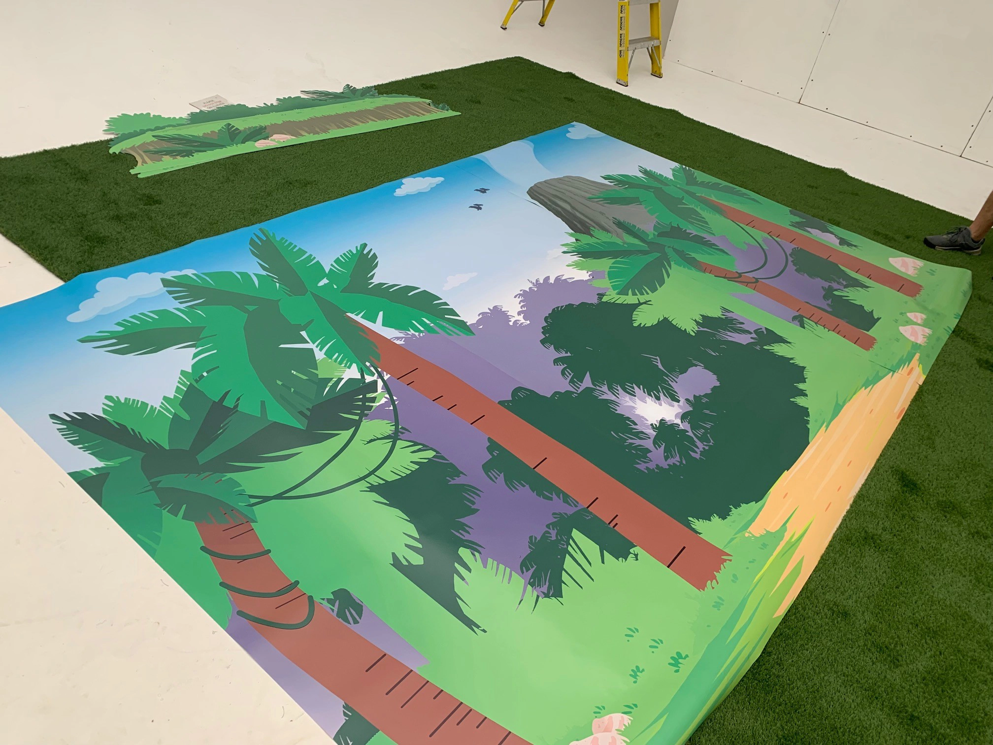 Illustrated large-format backdrop installed on the production set